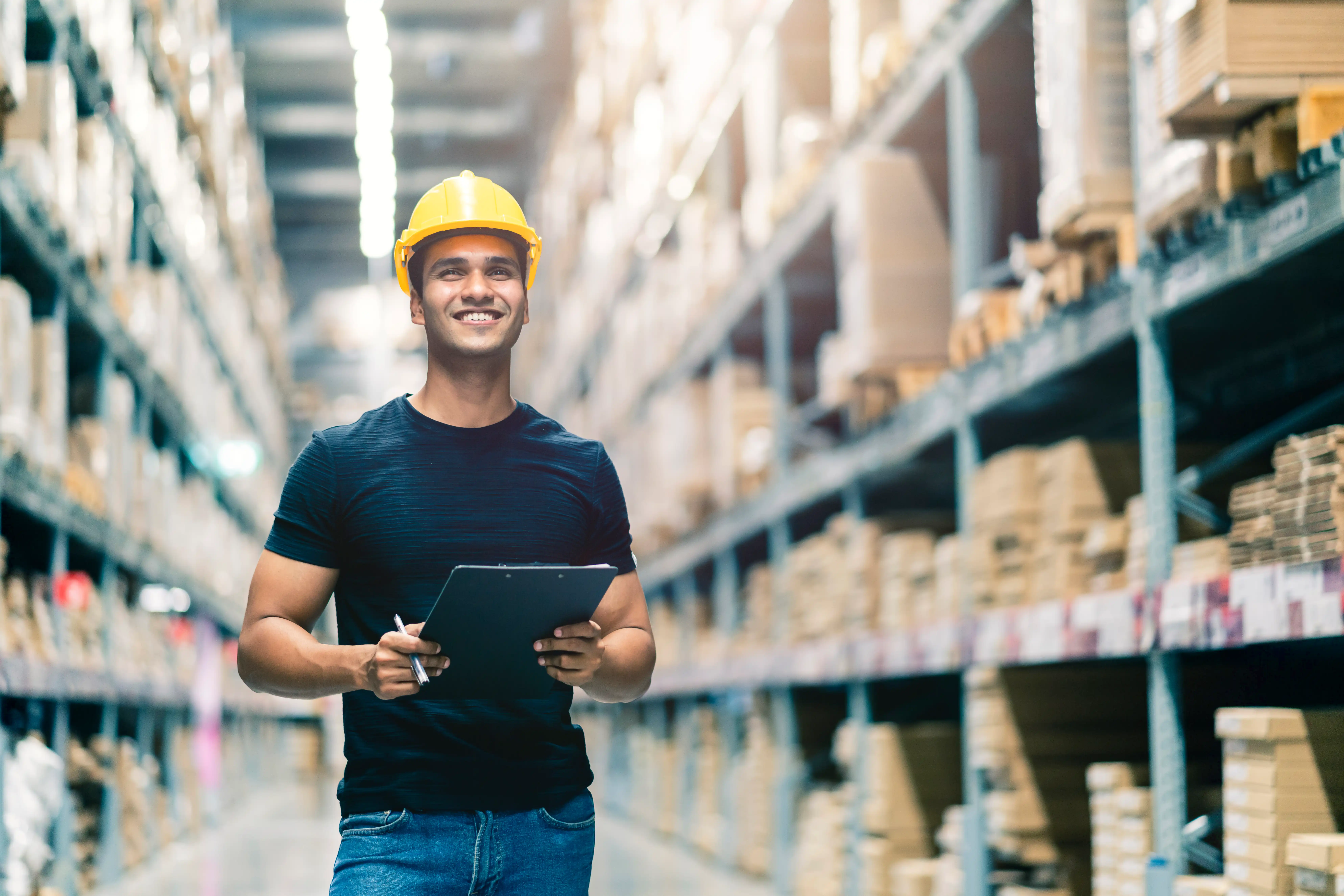 smart-indian-engineer-man-wearing-safety-helmet-doing-stock-tick-check-cardboard-stock-product-management-factory-warehouse-background - compressed