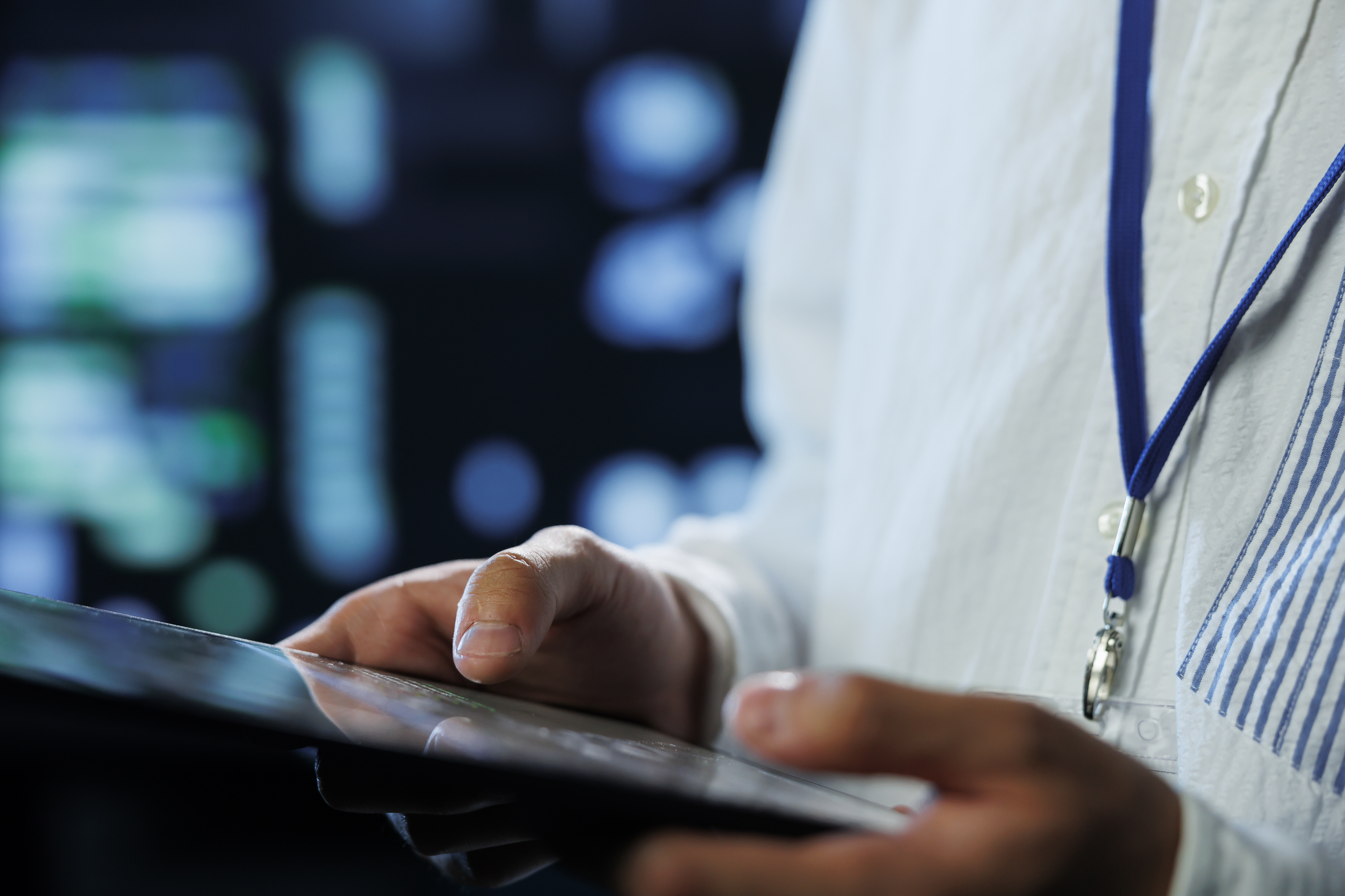 engineer-data-center-using-tablet-prevent-system-overload-close-up-employee-server-room-ensuring-there-is-enough-network-connectivity-smooth-operations-blurry-background