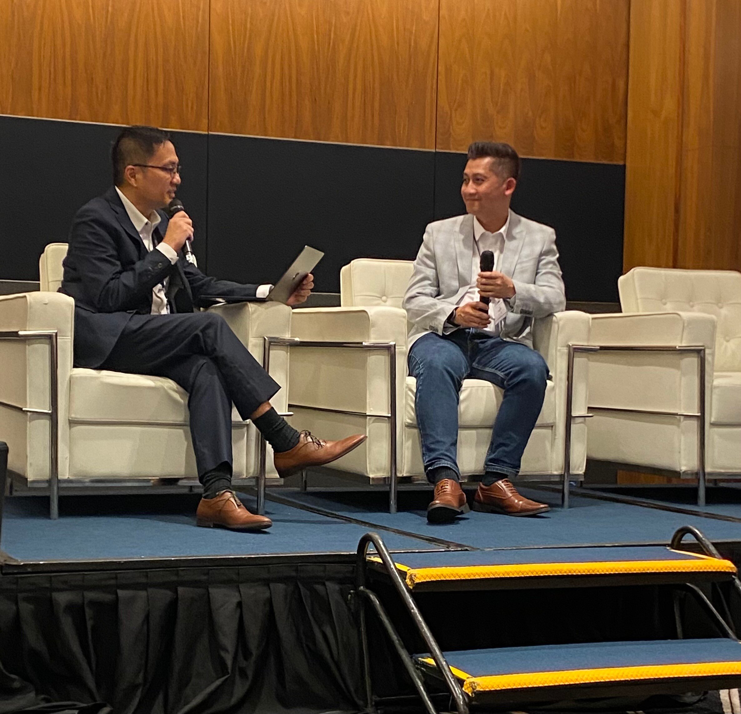 Victor Wong and Muhd-Affan MOHD-NOOR from TotalEnergies on stage at the Bizzmine QHSE Summit in Singapore